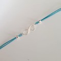 1006-BR-5-jeweline-bransoletka-sznurkowa-nieskończoność-z-kotem-sznurek-niebieski.jpg