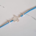 1007-BR-9-jeweline-bransoletka-sznurkowa-zółw-origami-sznurek-niebieski.jpg
