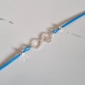 0923-BR-10-jeweline-bransoletka-sznurek-nieskończoność-łapa-srebro-925-niebieski.jpg