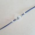 0854-BR-8-jeweline-bransoletka-sznurek-muszla-kauri-srebro-925-granat.jpg